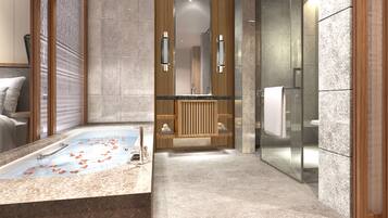 Bathroom features a large bathtub, glass shower enclosure, and wooden vanity with a marble countertop.
