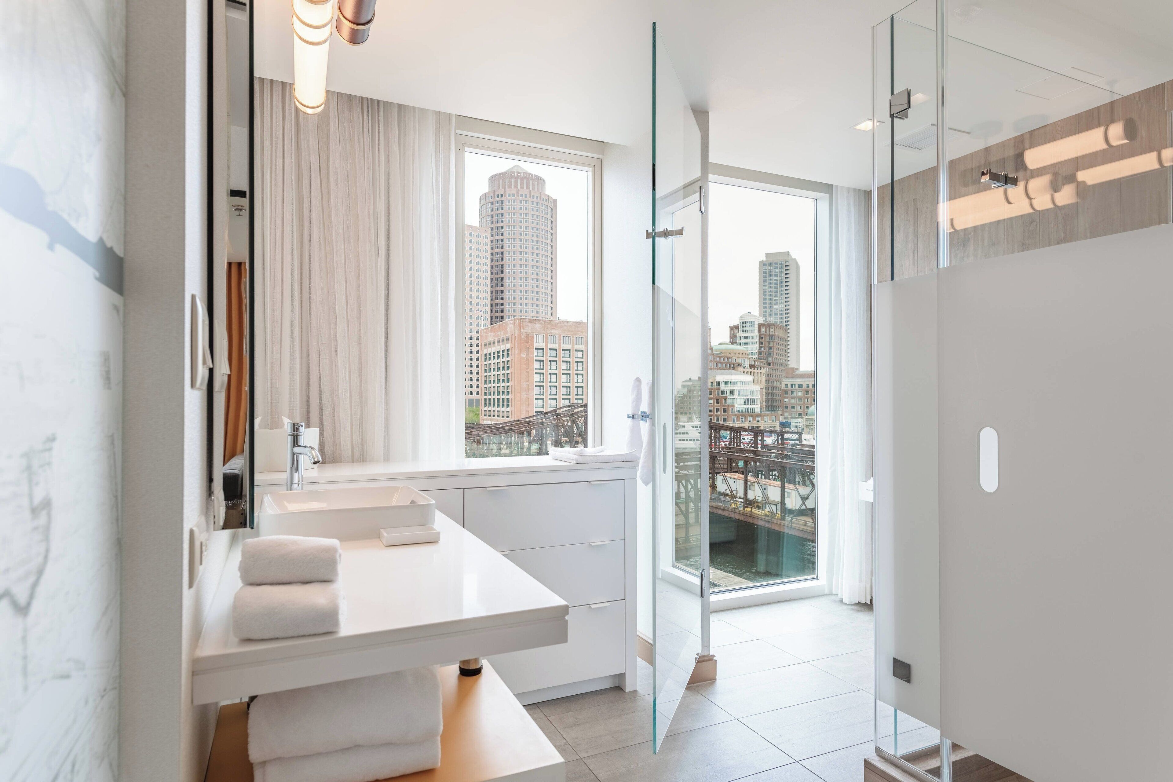 junior suite, 1 king bed, corner | bathroom | shower, free toiletries, hair dryer, towels