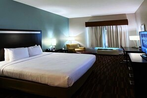 Desk, laptop workspace, blackout drapes, iron/ironing board