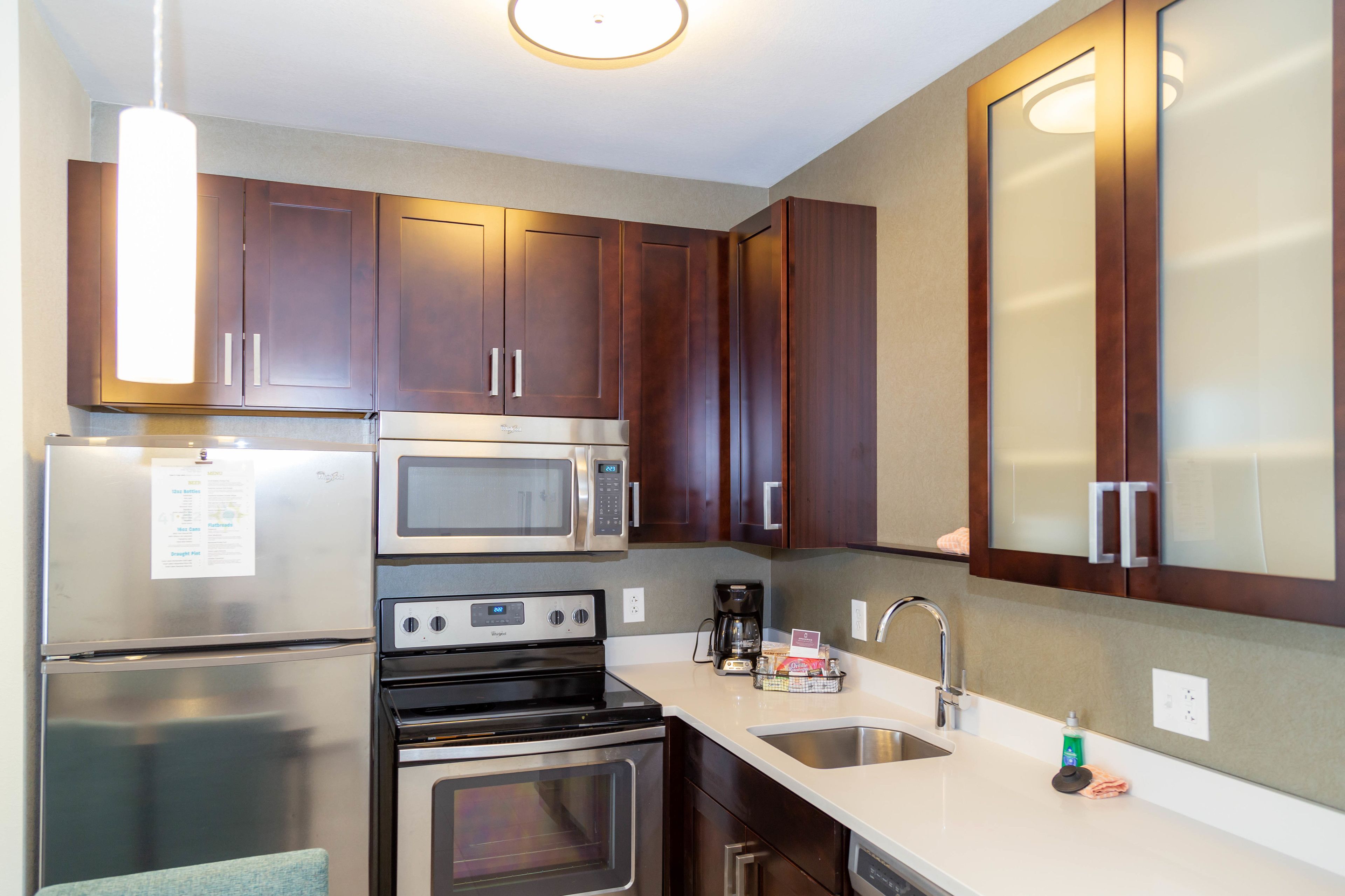 full-sized fridge, microwave, stovetop, dishwasher