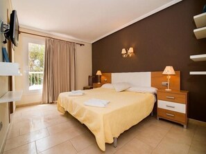 Family Room | Desk, blackout drapes, iron/ironing board, free cribs/infant beds - Hostal Cala Boix (Santa Eulalia del Rio)