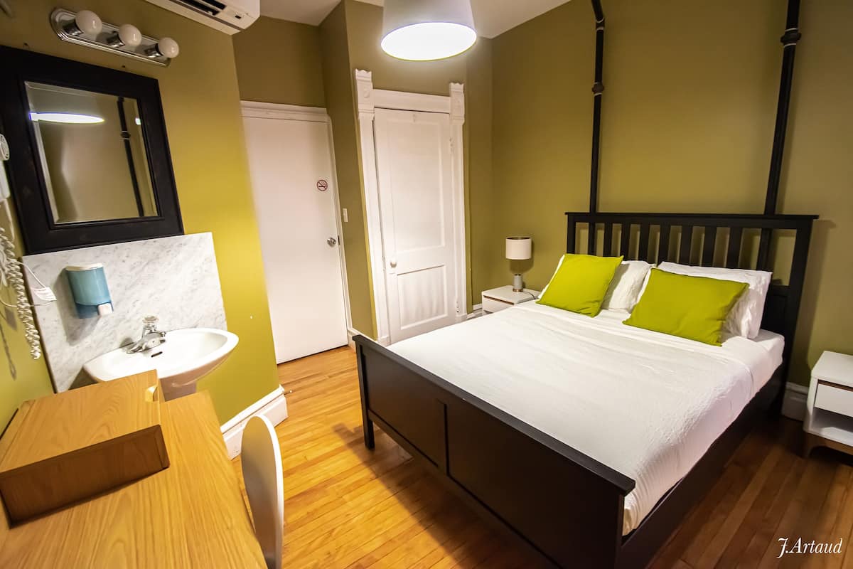 Premium bedding, desk, laptop workspace, soundproofing