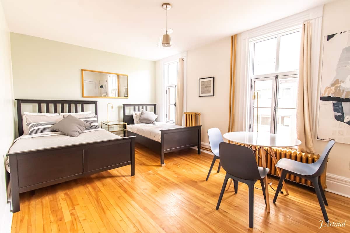 Premium bedding, desk, laptop workspace, soundproofing