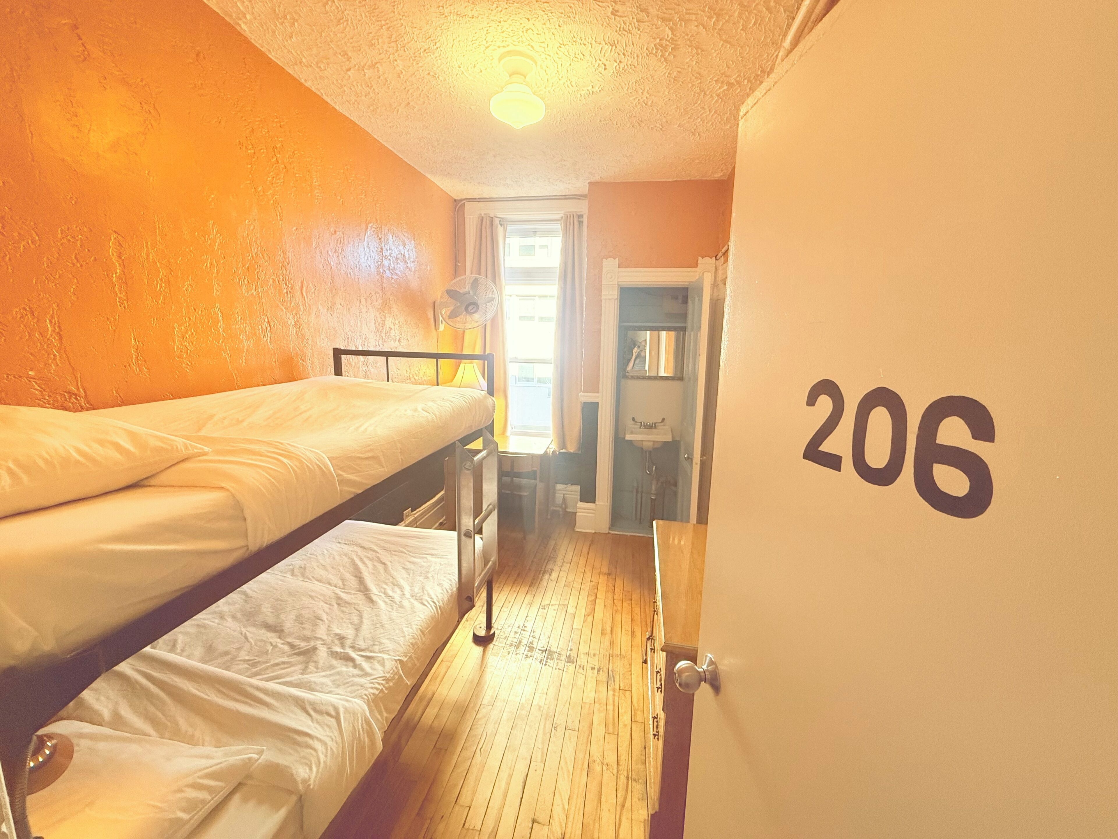 Budget Twin Bunk Room with Shared Bathroom | Premium bedding, desk, laptop workspace, soundproofing