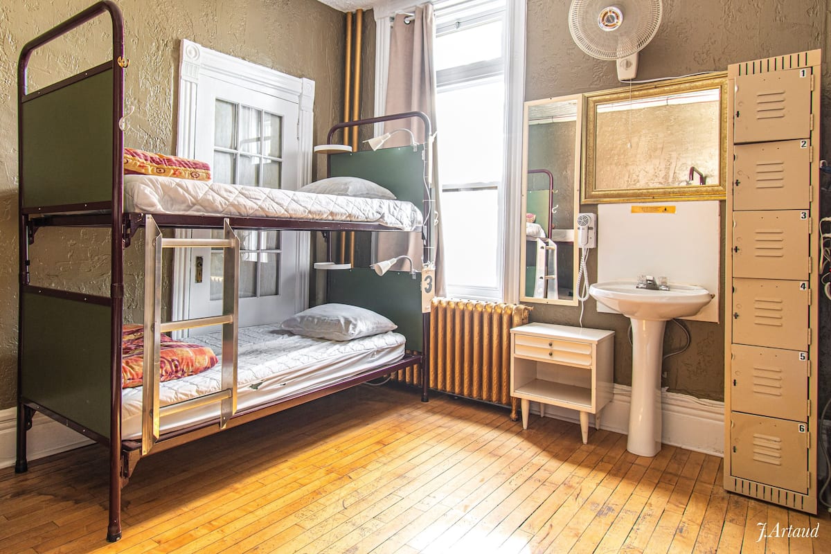 Premium bedding, desk, laptop workspace, soundproofing