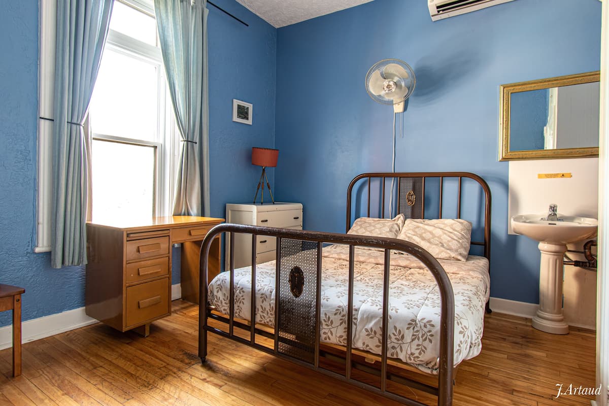 Premium bedding, desk, laptop workspace, soundproofing