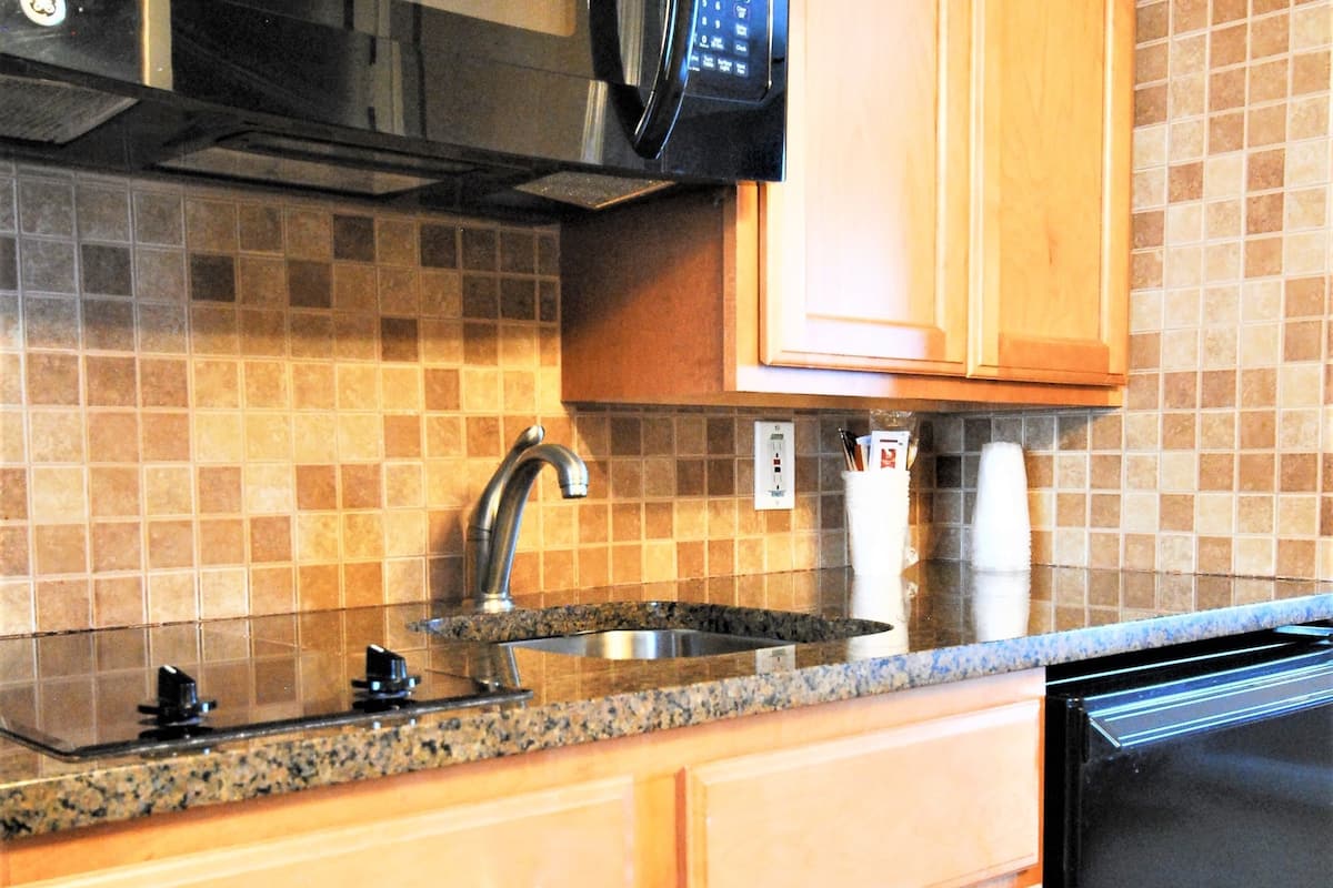 1 king bed with sofa bed suite, kitchenette, sundeck view exterior entrance | private kitchenette | fridge, microwave, coffee/tea maker