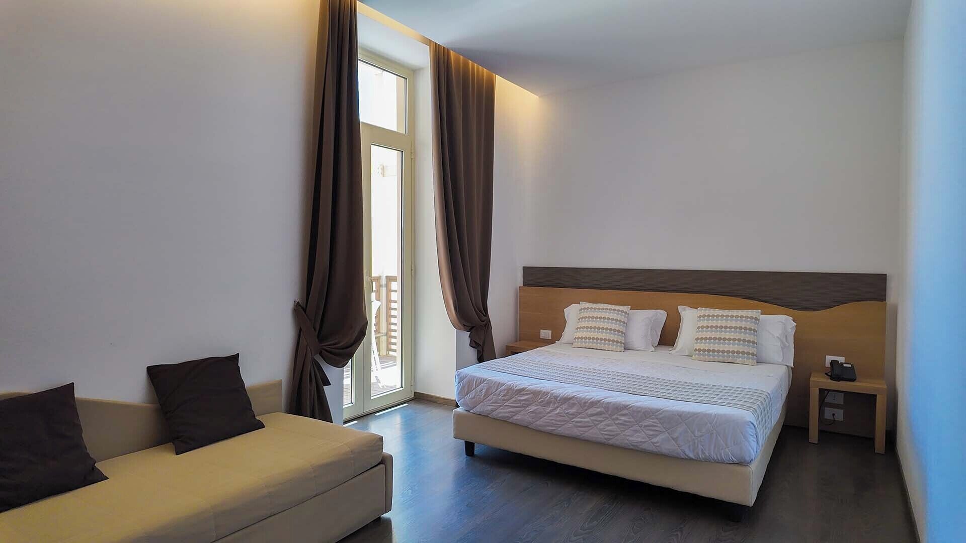 Classic Triple Room, Sea View | Minibar, in-room safe, desk, blackout drapes