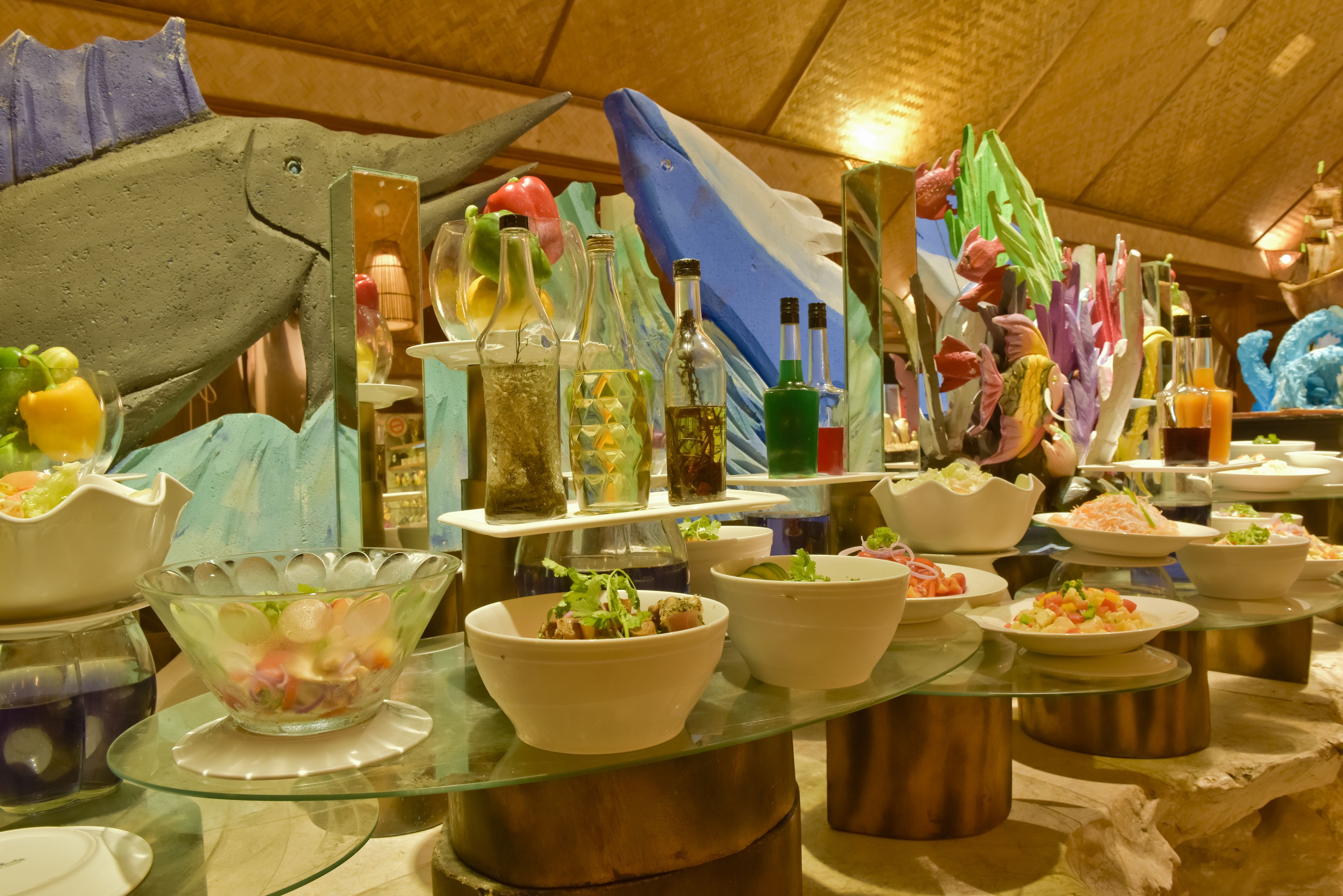 A buffet with various dishes and drinks.
