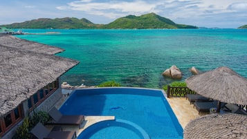 Outdoor pool, open 9:00 AM to 7 PM, pool umbrellas, pool loungers