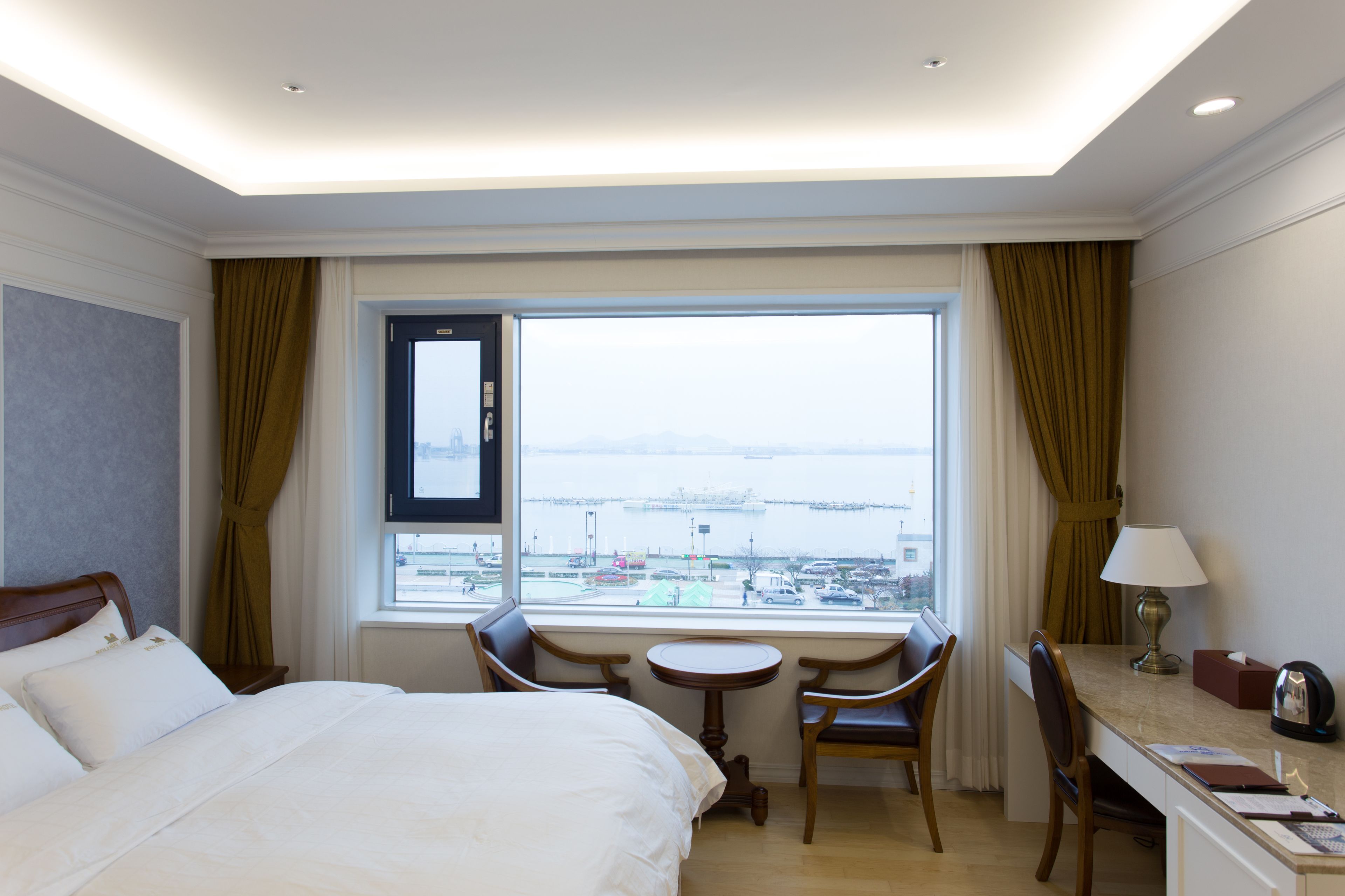 premium bedding, desk, laptop workspace, blackout curtains