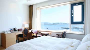 Premium bedding, desk, laptop workspace, blackout curtains