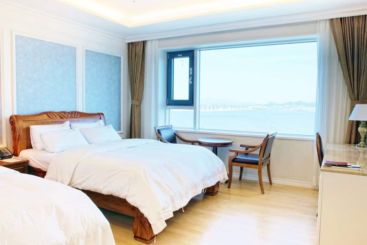 deluxe twin room | premium bedding, desk, laptop workspace, blackout curtains