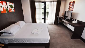 Desk, blackout drapes, iron/ironing board, bed sheets