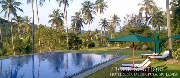 Outdoor pool, pool umbrellas, sun loungers