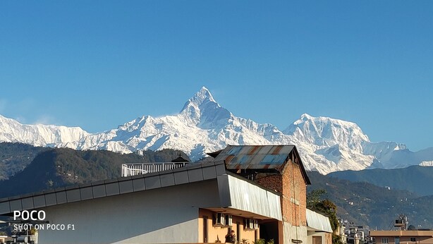 A mountain range with snow-capped peaks in the background. - Hotel Mountain View (Pokhara)