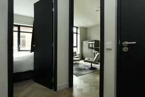 Standard-Apartment, 1 Schlafzimmer, Stadtblick | Wohnbereich | Flachbildfernseher