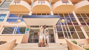 A building with a modern architectural style, featuring a series of balconies and large windows. - Welikehotel Fenix (Llucmajor)