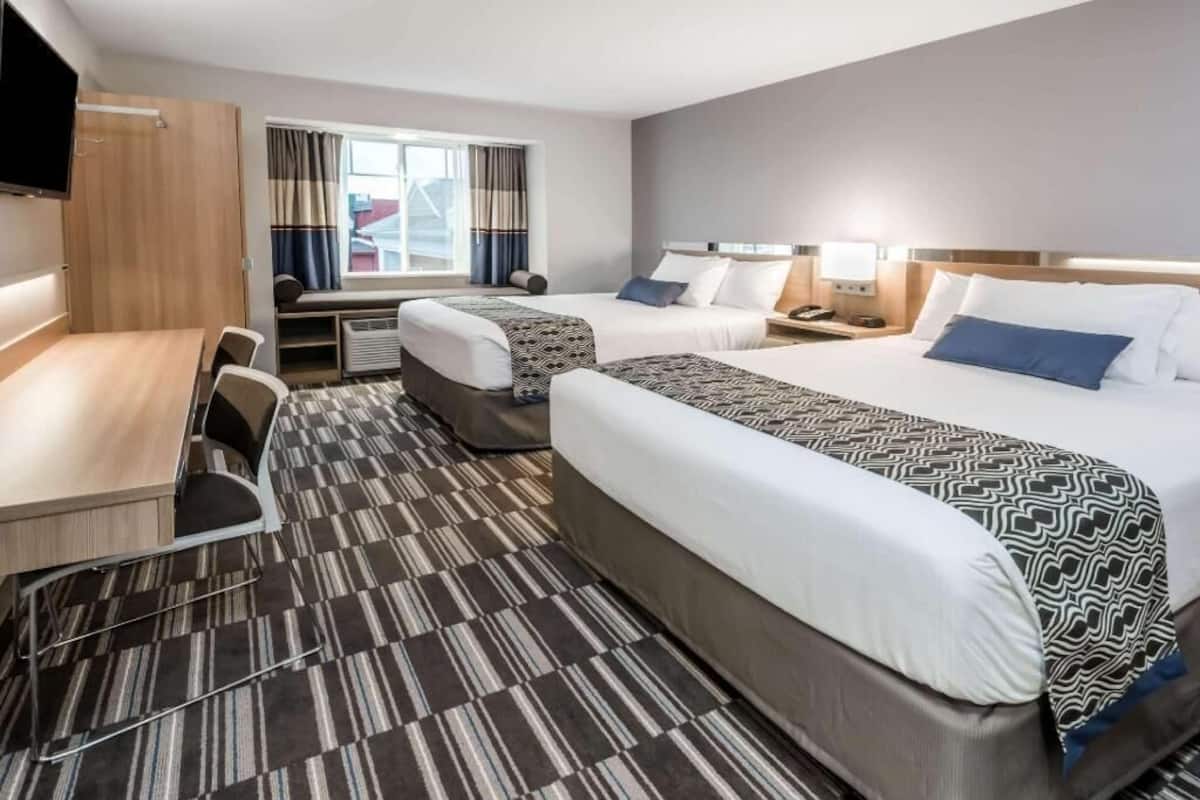Premium bedding, down comforters, pillowtop beds, in-room safe