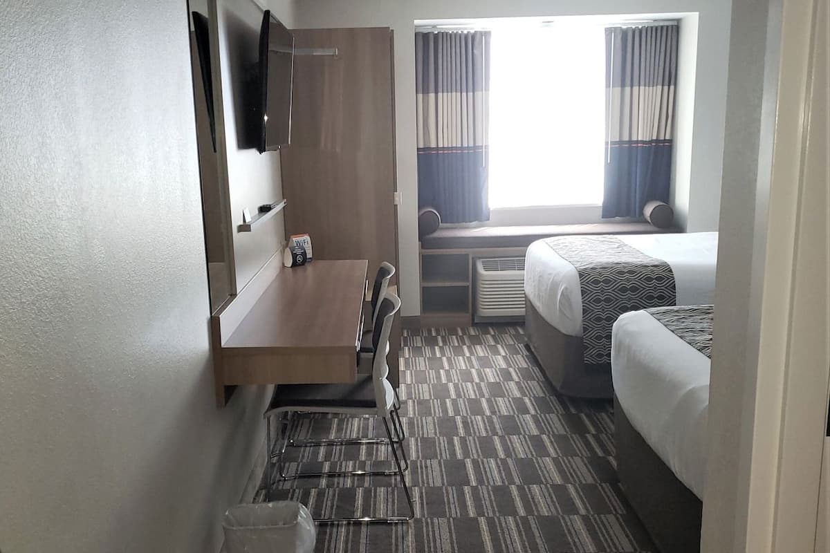 Premium bedding, down comforters, pillowtop beds, in-room safe
