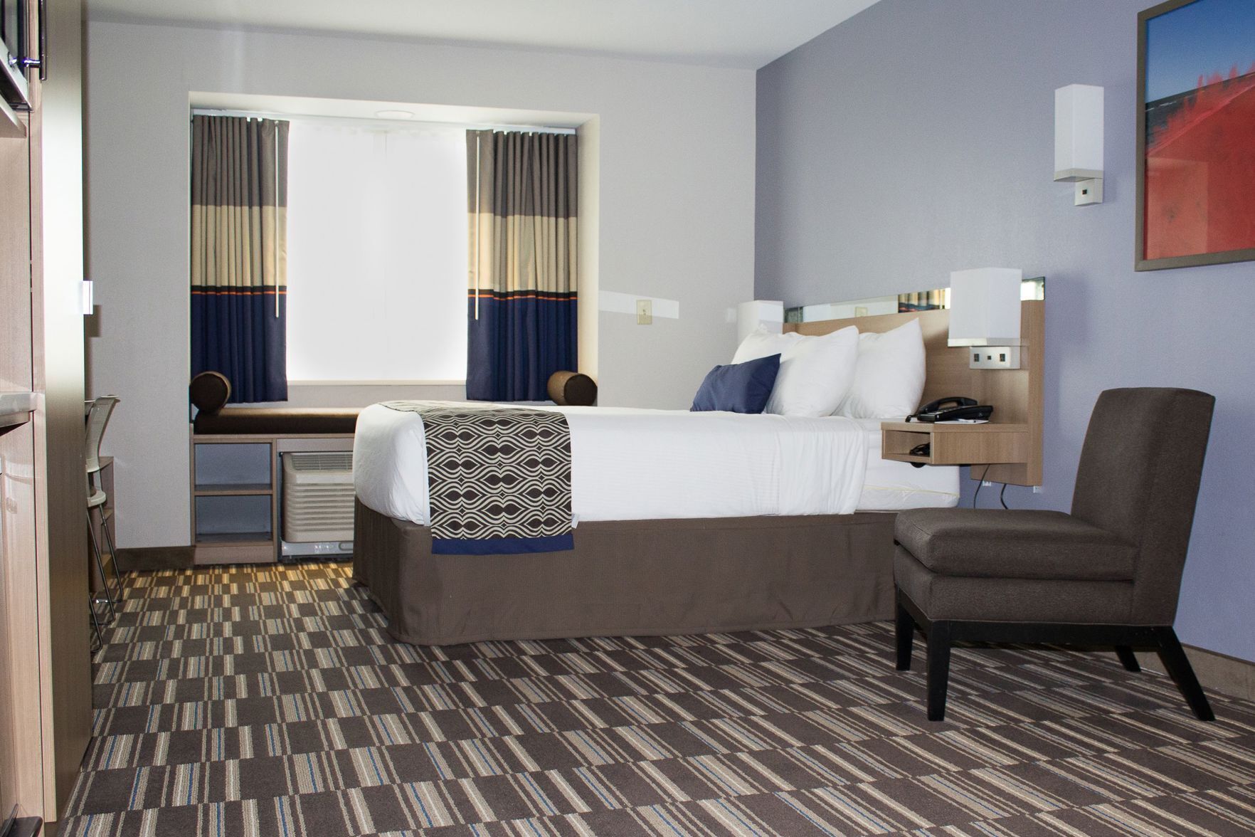 Premium bedding, down comforters, pillowtop beds, in-room safe