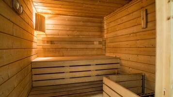 A sauna with wooden walls and benches.