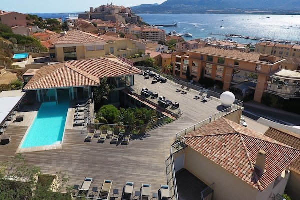 Seasonal outdoor pool, open 8:30 AM to 8:00 PM, sun loungers