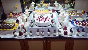 A buffet with various desserts and drinks. - Palm Dor Hotel (Manavgat)