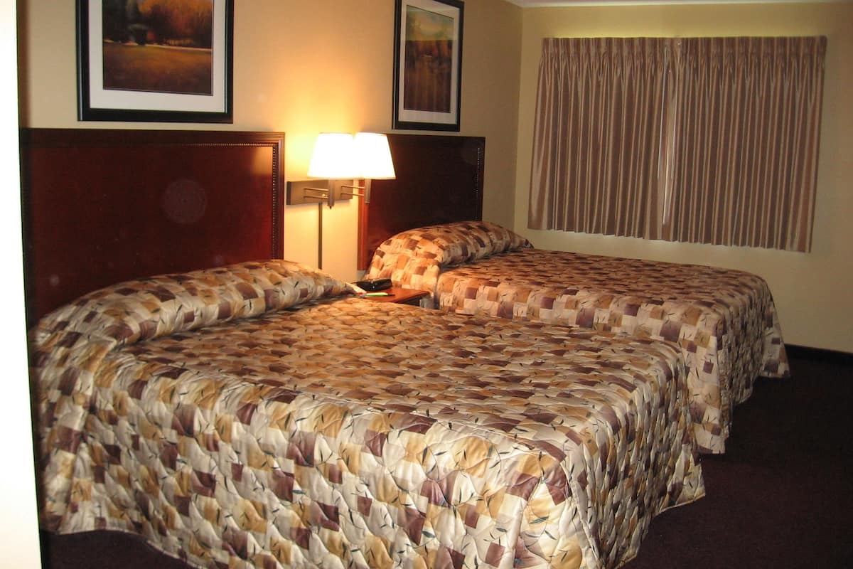 standard room, 2 queen beds | pillow-top beds, desk, free cots/infant beds, free rollaway beds