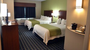 A hotel room with two beds, a desk, and a minibar. - Brookstone Lodge & Suites (Algona)