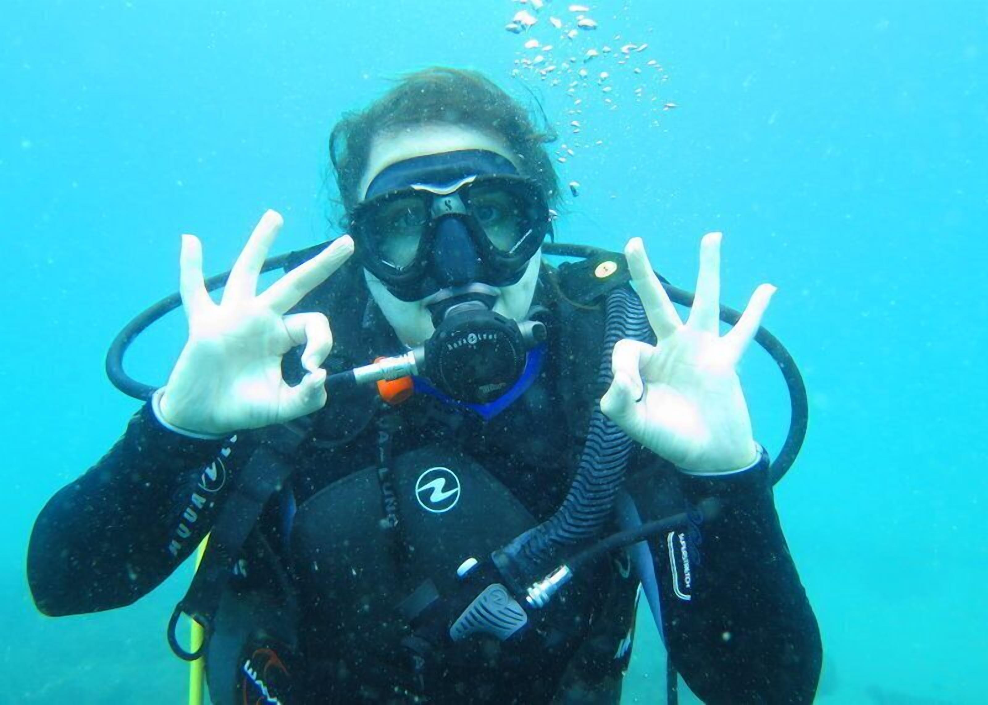 A person scuba diving underwater.