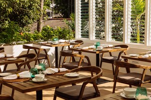 Breakfast, lunch, dinner served; international cuisine, garden views