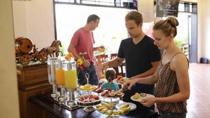A buffet setup with various food items and drinks. - Phuc Thao Villa (Da Nang)