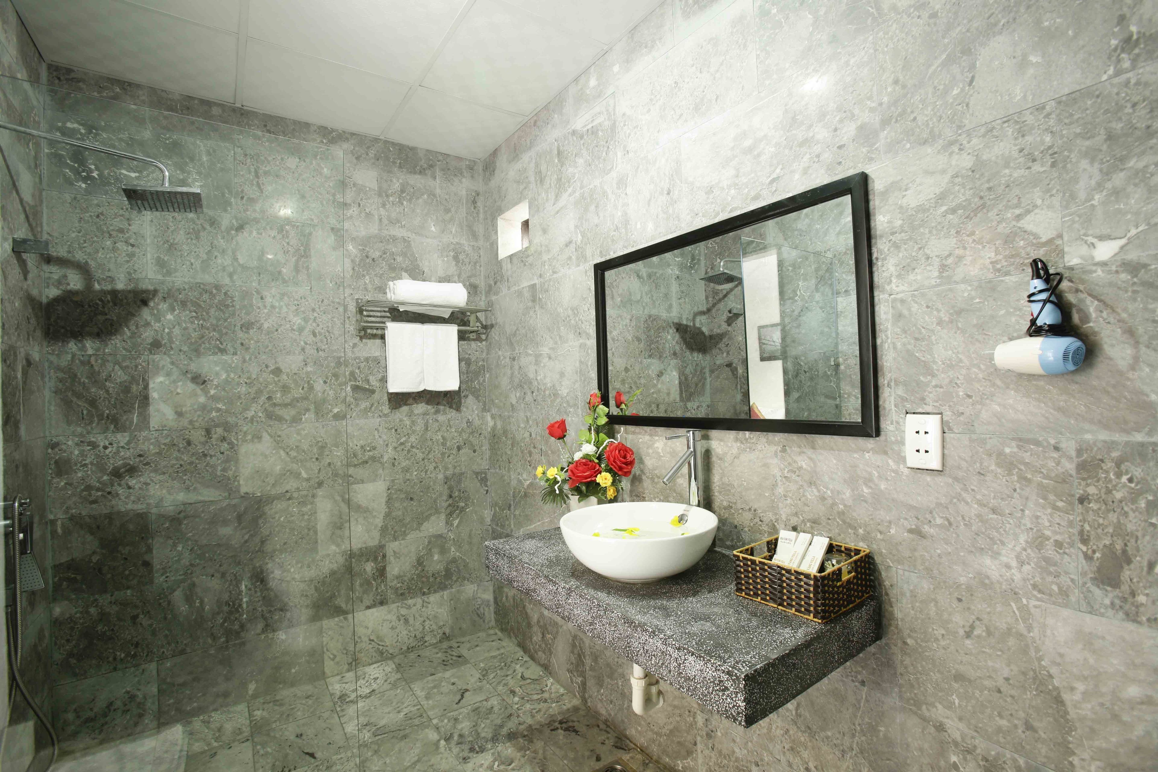 shower, designer toiletries, hair dryer, slippers