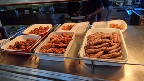 A buffet with various dishes including meatballs, chicken wings, and sausages. - Kathu Inn by Country Hotels (Kathu)