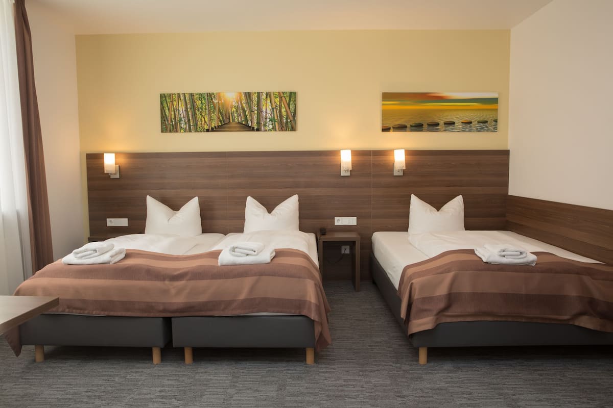 Triple Room | Minibar, in-room safe, desk, soundproofing