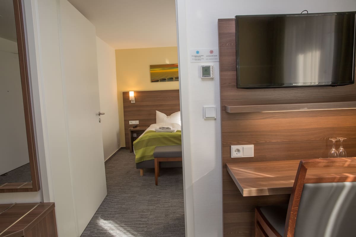 Twin Room | Minibar, in-room safe, desk, soundproofing