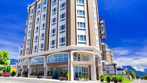 A multi-story hotel with a modern design, featuring a prominent entrance with large windows and a covered area. - Hualien Lohas Hotel (Hualien City)