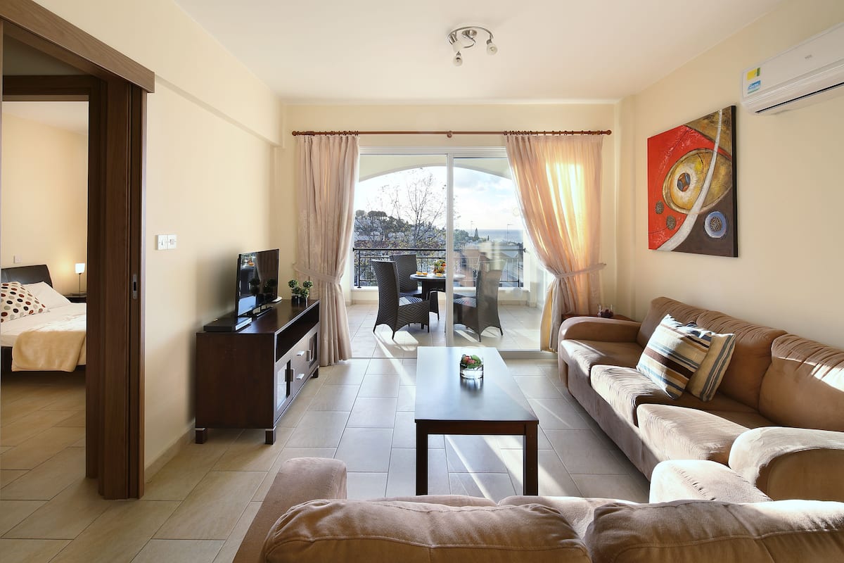 Apartment, 1 Bedroom, Sea View | Living area | Flat-screen TV