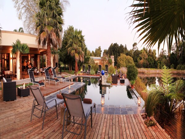 Outdoor pool, open 6:30 AM to 7:00 PM, pool umbrellas, sun loungers