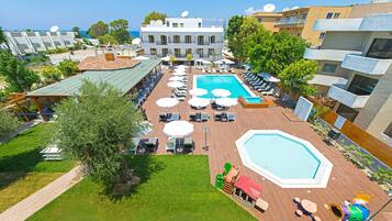 Seasonal outdoor pool, open 10:00 AM to 6:00 PM, pool umbrellas