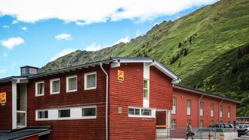 Situated in a mountainous area, this hotel offers stunning views of lush greenery and a clear sky.