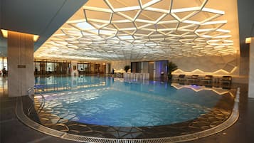 Indoor pool, open 8:00 AM to 11:00 PM, pool loungers
