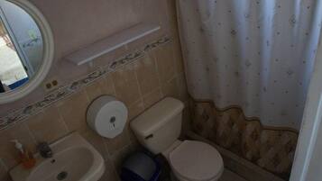 Double Room, 2 Double Beds | Bathroom | Shower, free toiletries, towels