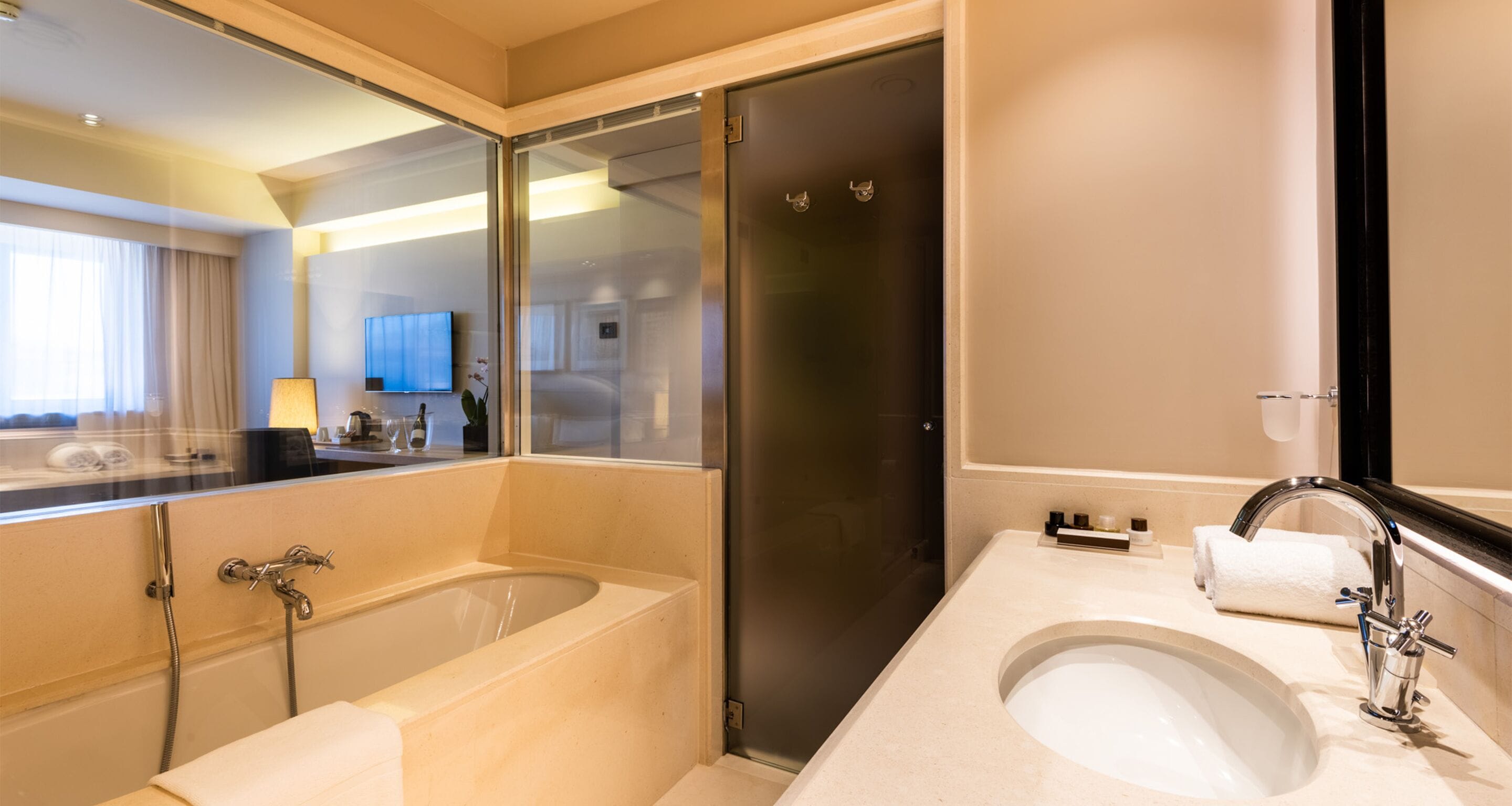 combined shower/bathtub, rainfall showerhead, designer toiletries