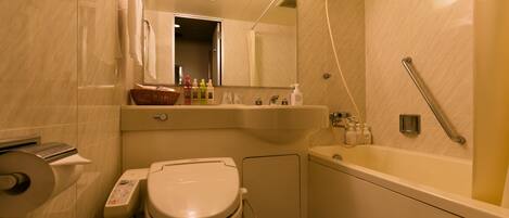 A bathroom with a toilet, sink, and bathtub.
