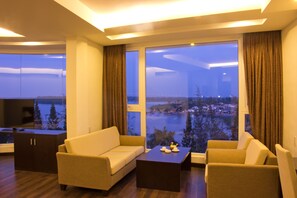 Executive Room, River View | Living area | LCD TV