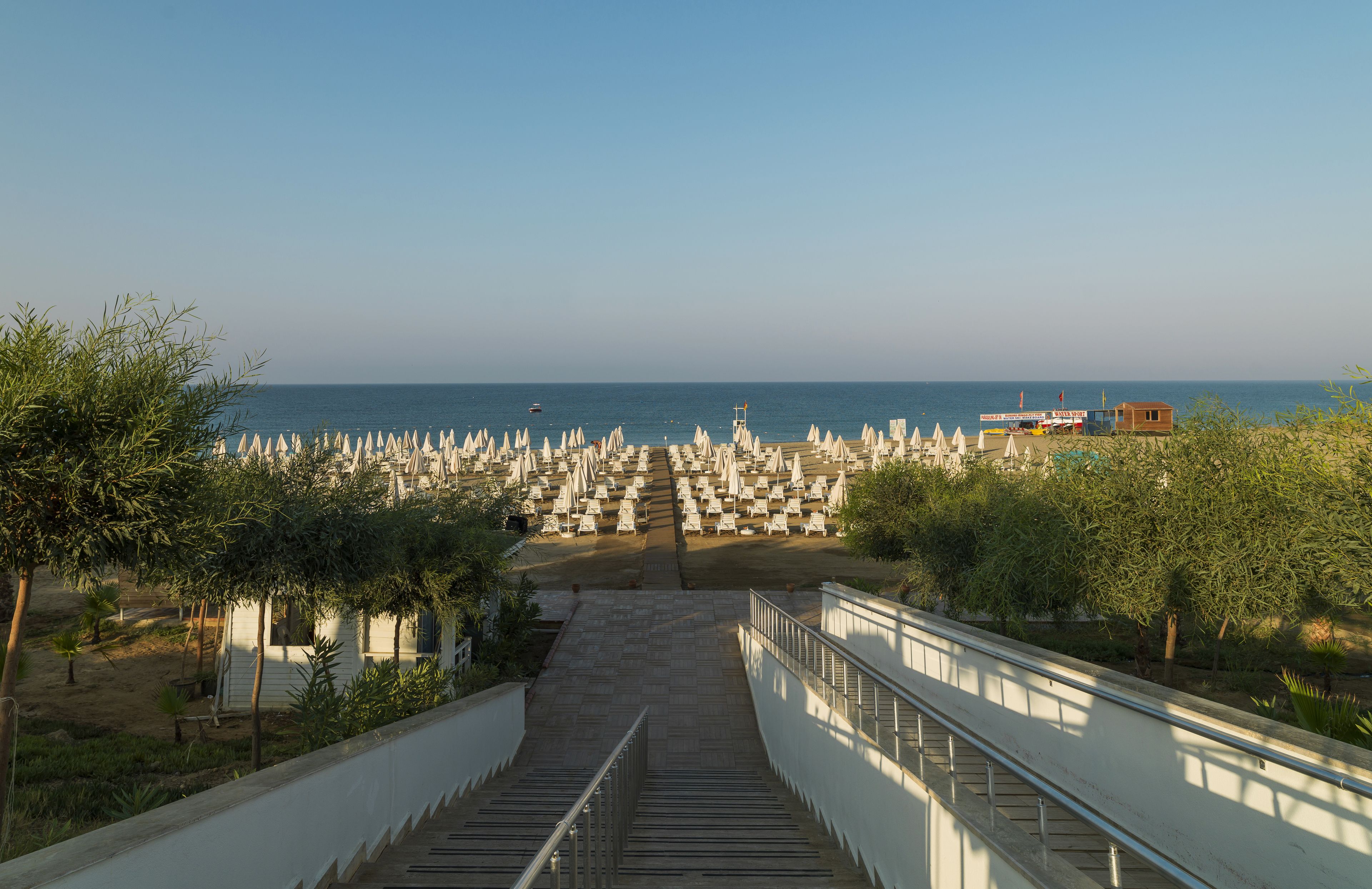 Private beach, black sand, sun-loungers, beach umbrellas