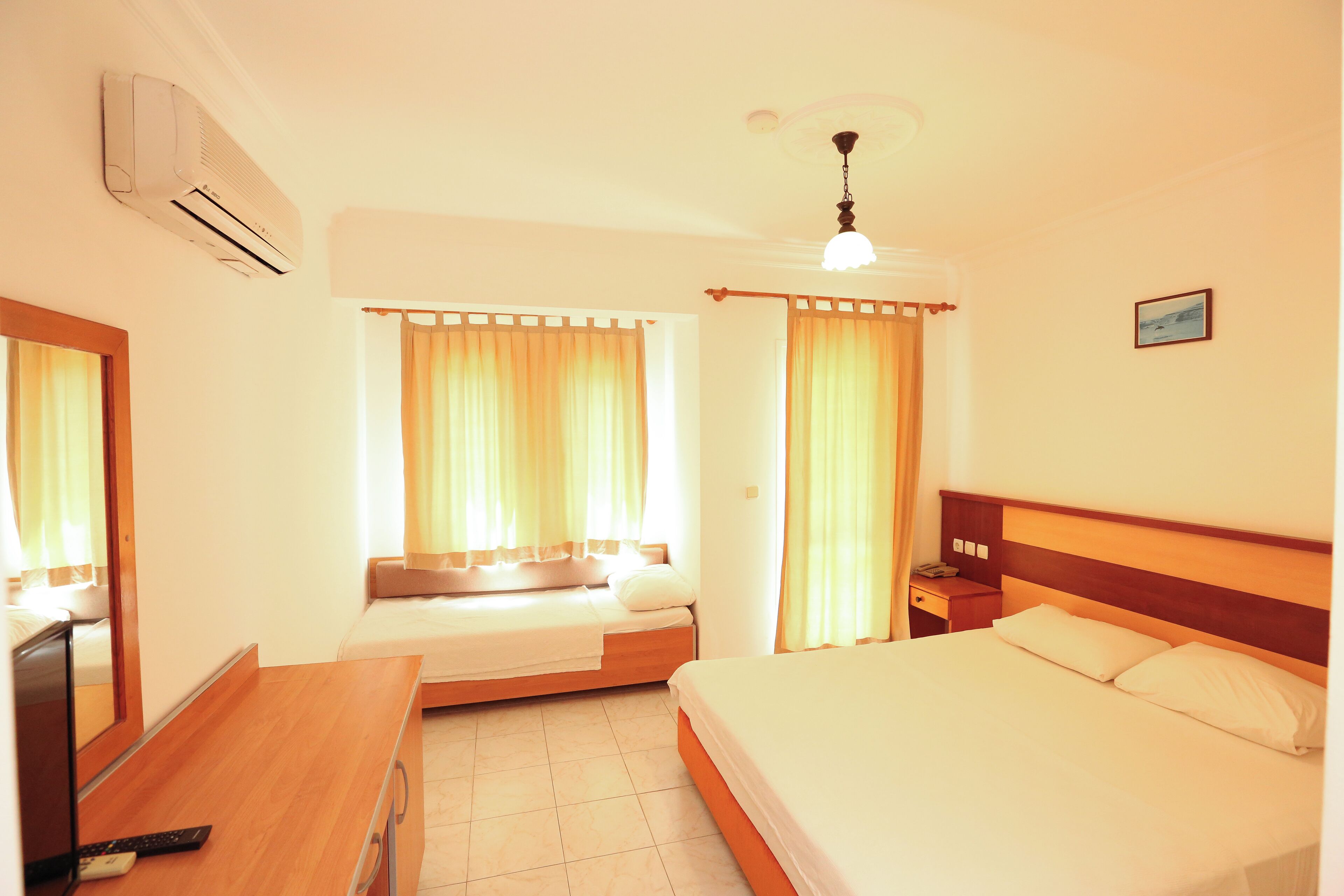 Standard Triple Room | In-room safe, free cribs/infant beds