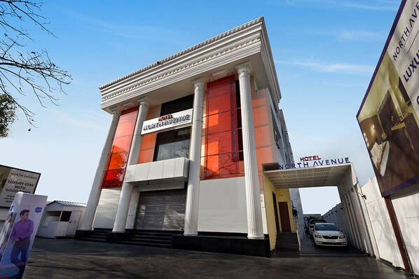 A hotel with a classical facade, large columns, and a prominent entrance. - Five Elements Hotels North Avenue Delhi (New Delhi)